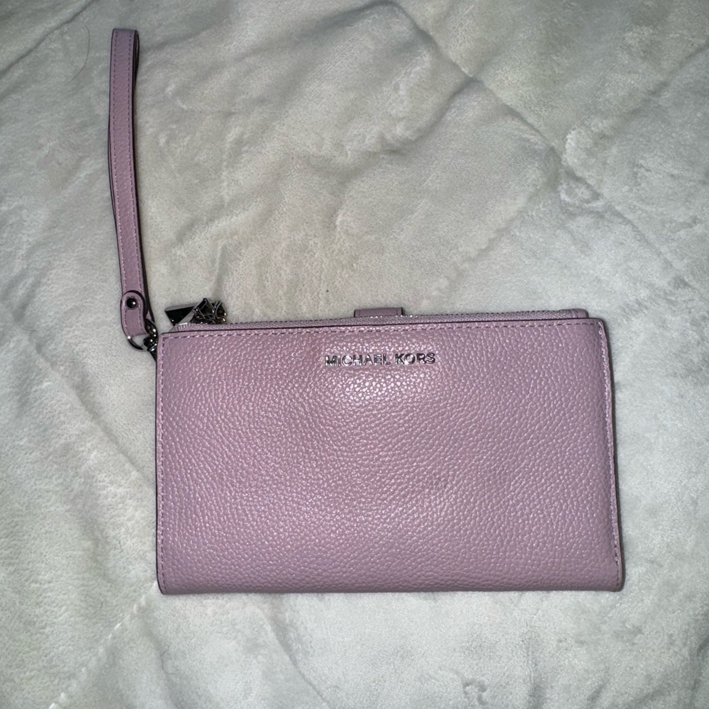 Michael Kors Wristlet in a purple/pink color